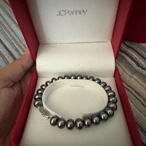 Black pearls- Tahitian pearls. Set of three..bracelet, necklace, and earrings.